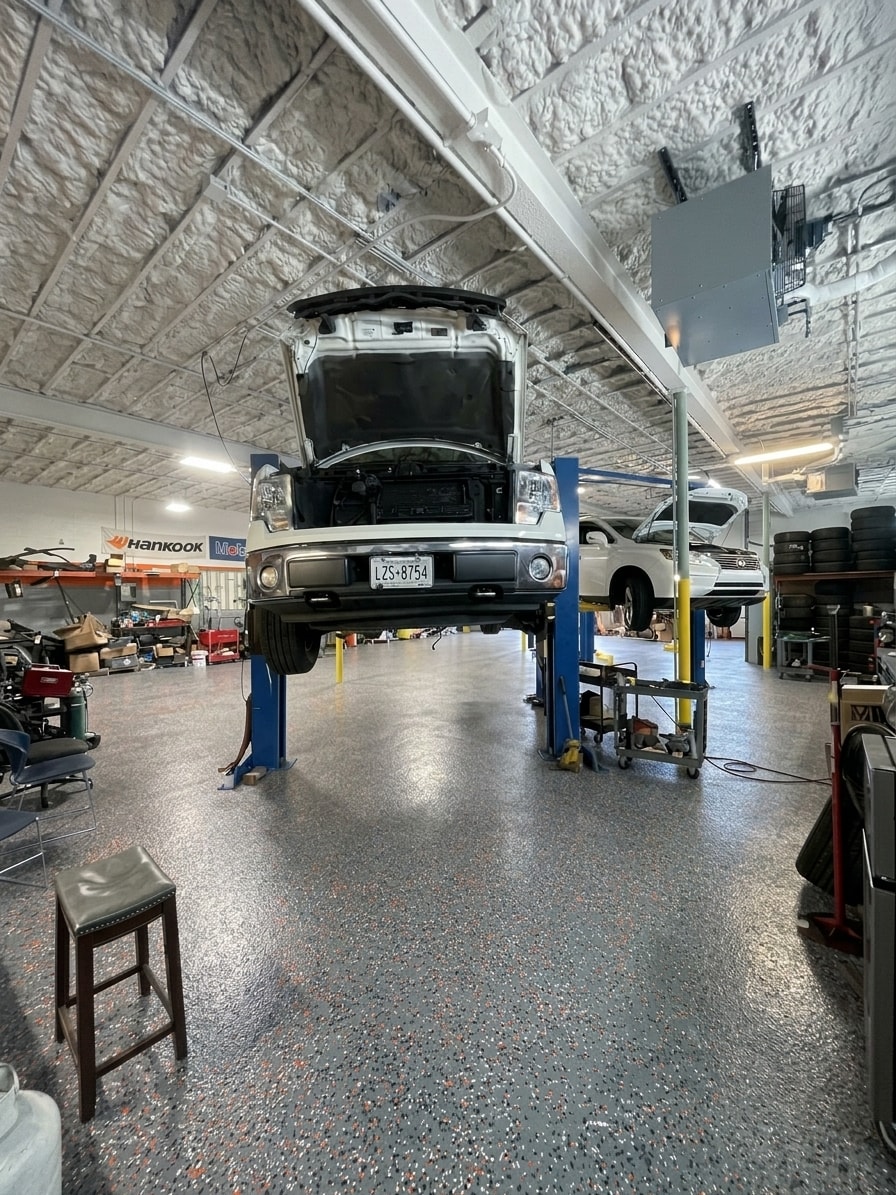 CarMart repair shop floor with vehicles on lifts